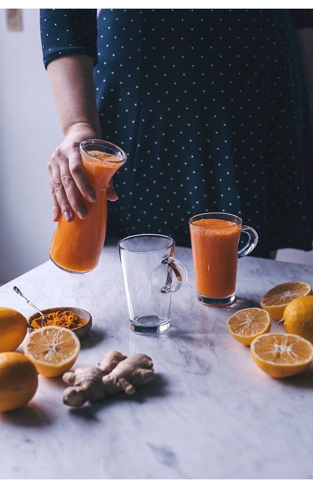 Orange, carrot and lemon juice with turmeric and ginger